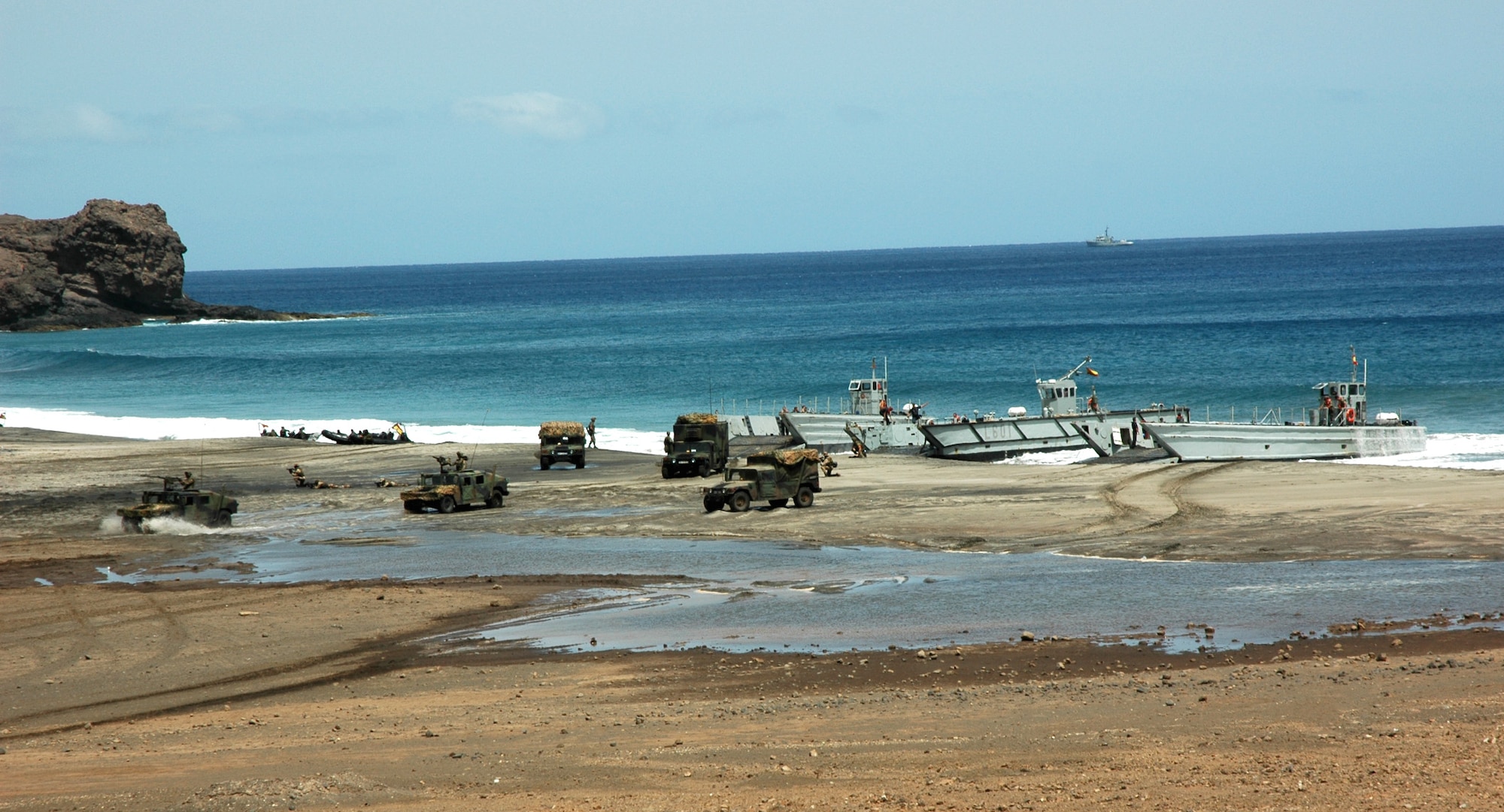 A simulated amphibious and land assault is conducted in Sao Vicente, Cape Verde, on Friday, June 23, to demonstrate NATO's show of force during Exercise Steadfast Jaguar. More than 7,000 NATO servicemembers from land, maritime and air components are participating in the exercise, which ends today. (U.S. Air Force photo/Capt. Krista Carlos) 