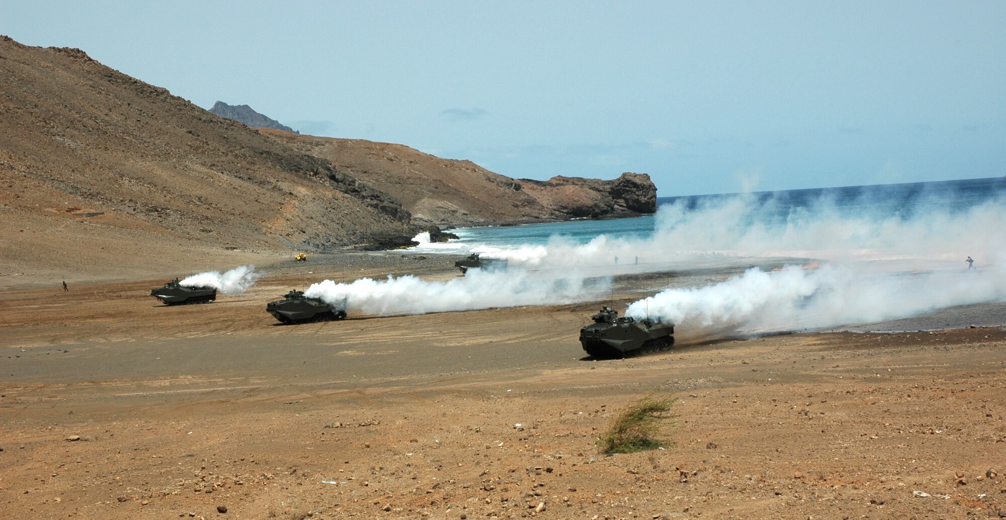 A simulated amphibious and land assault is conducted in Sao Vicente, Cape Verde, on Friday, June 23, to demonstrate NATO's show of force during Exercise Steadfast Jaguar. More than 7,000 NATO servicemembers from land, maritime and air components are participating in the exercise, which ends today. (U.S. Air Force photo/Capt. Krista Carlos) 