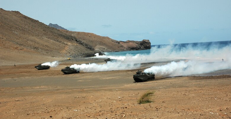 A simulated amphibious and land assault is conducted in Sao Vicente, Cape Verde, on Friday, June 23, to demonstrate NATO's show of force during Exercise Steadfast Jaguar. More than 7,000 NATO servicemembers from land, maritime and air components are participating in the exercise, which ends today. (U.S. Air Force photo/Capt. Krista Carlos) 