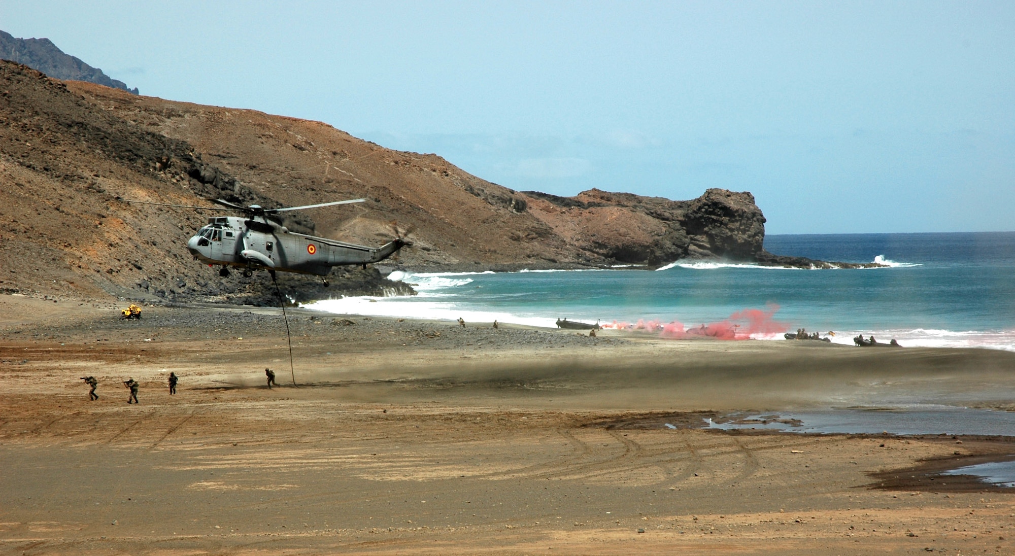 A simulated amphibious and land assault is conducted in Sao Vicente, Cape Verde, on Friday, June 23, to demonstrate NATO's show of force during Exercise Steadfast Jaguar. More than 7,000 NATO servicemembers from land, maritime and air components are participating in the exercise, which ends today. (U.S. Air Force photo/Capt. Krista Carlos) 