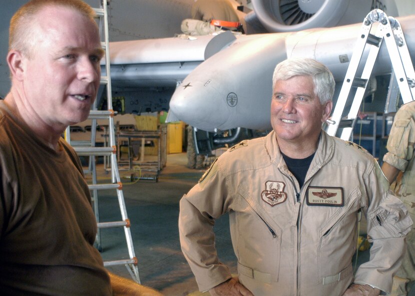 Maj. Gen. Allan Poulin, right, vice commander of Air Force Reserve Command, listens to Senior Master Sgt. Gary Thornberry in an A-10 maintenance hangar at Bagram Airfield, Afghanistan, June 28, 2006. Sergeant Thornberry is an Air Force reservist deployed to Bagram from the 442nd Fighter Wing at Whiteman Air Force Base, Mo. General Poulin visited the base with Chief Master Sgt. Lawrence Chang, 10th Air Force command chief master sergeant.  (U.S. Air Force photo/Maj. David Kurle)