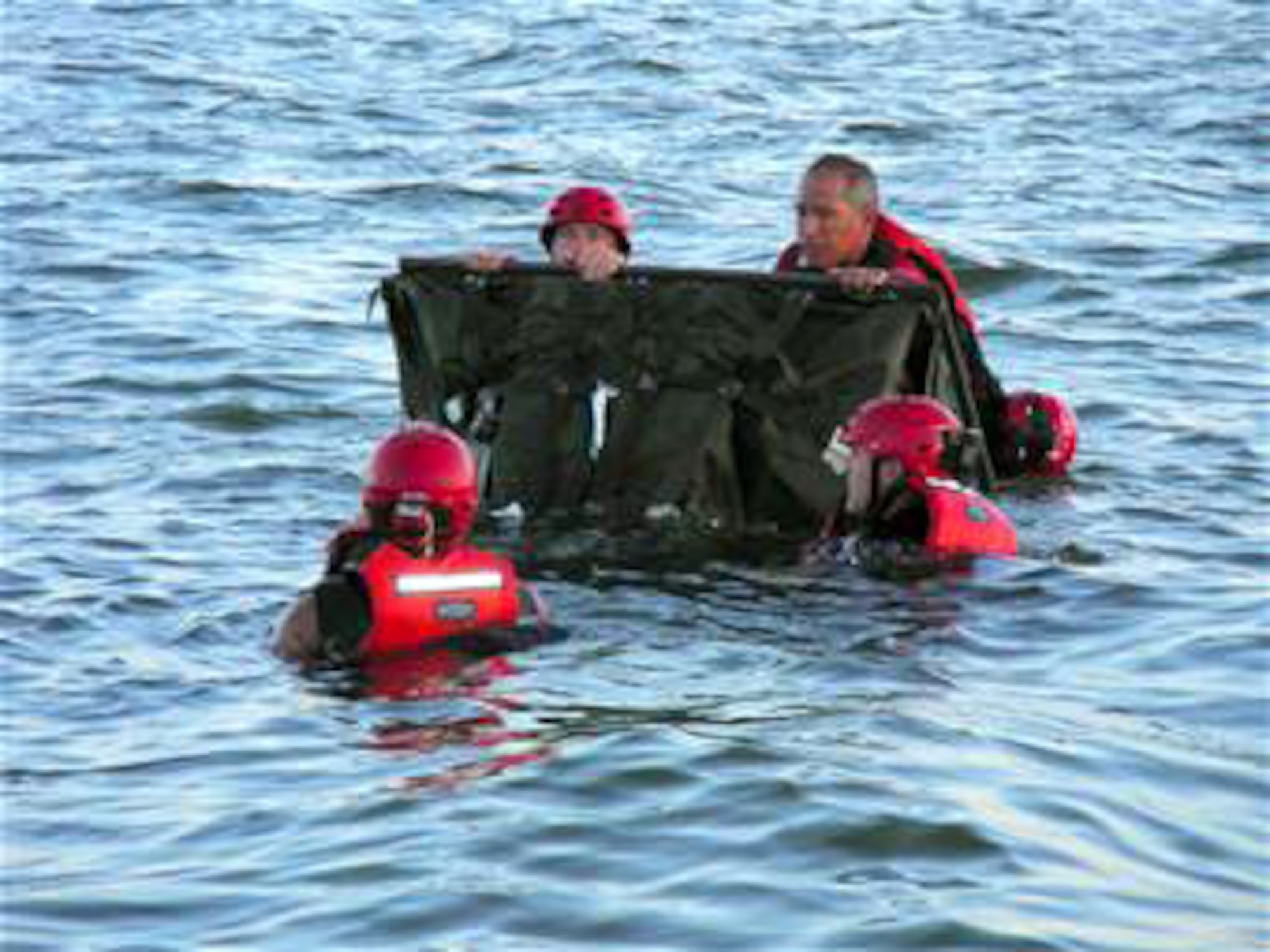 Pararescuemen from the 920th Rescue Wing inflate a motorized boat during open water recovery training in the Banana River near Patrick Air Force Base, Fla., on Friday, June 23. (U.S. Air Force photo/1st Lt. Cathleen Snow) 

