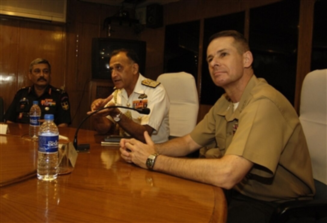 Chairman of the Joint Chiefs of Staff U.S. Marine Gen. Peter Pace, right, during his first visit to India, receives a briefing while accompanied by his Indian counterpart, Adm. Arun Prakash in New Delhi, India, June 5, 2006.
