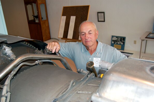 Dick Wolff checks the U-2 engine display for damage at the Laughlin Heritage Foundation Museum in Del Rio, Texas, on Tuesday, June 27. The museum has been open for six months and is run by volunteers. Mr. Wolff is vice president for the Laughlin Heritage Foundation. (U.S. Air Force photo/Staff Sgt. Jeremy Larlee) 
