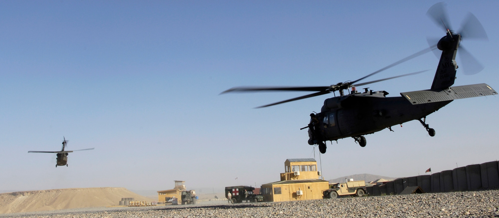 An HH-60 Pave Hawk helicopter and an Army UH-60 Blackhawk take off during a medevac mission June 13. The 33rd Expeditionary Rescue Squadron is the first squadron to have a combat-search-and-rescue mission and a medevac mission, and is based at Kandahar, Afghanistan. (U.S. Air Force photo/Senior Airman Brian Ferguson) 
