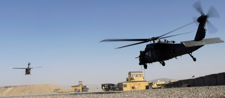 An HH-60 Pave Hawk helicopter and an Army UH-60 Blackhawk take off during a medevac mission June 13. The 33rd Expeditionary Rescue Squadron is the first squadron to have a combat-search-and-rescue mission and a medevac mission, and is based at Kandahar, Afghanistan. (U.S. Air Force photo/Senior Airman Brian Ferguson) 