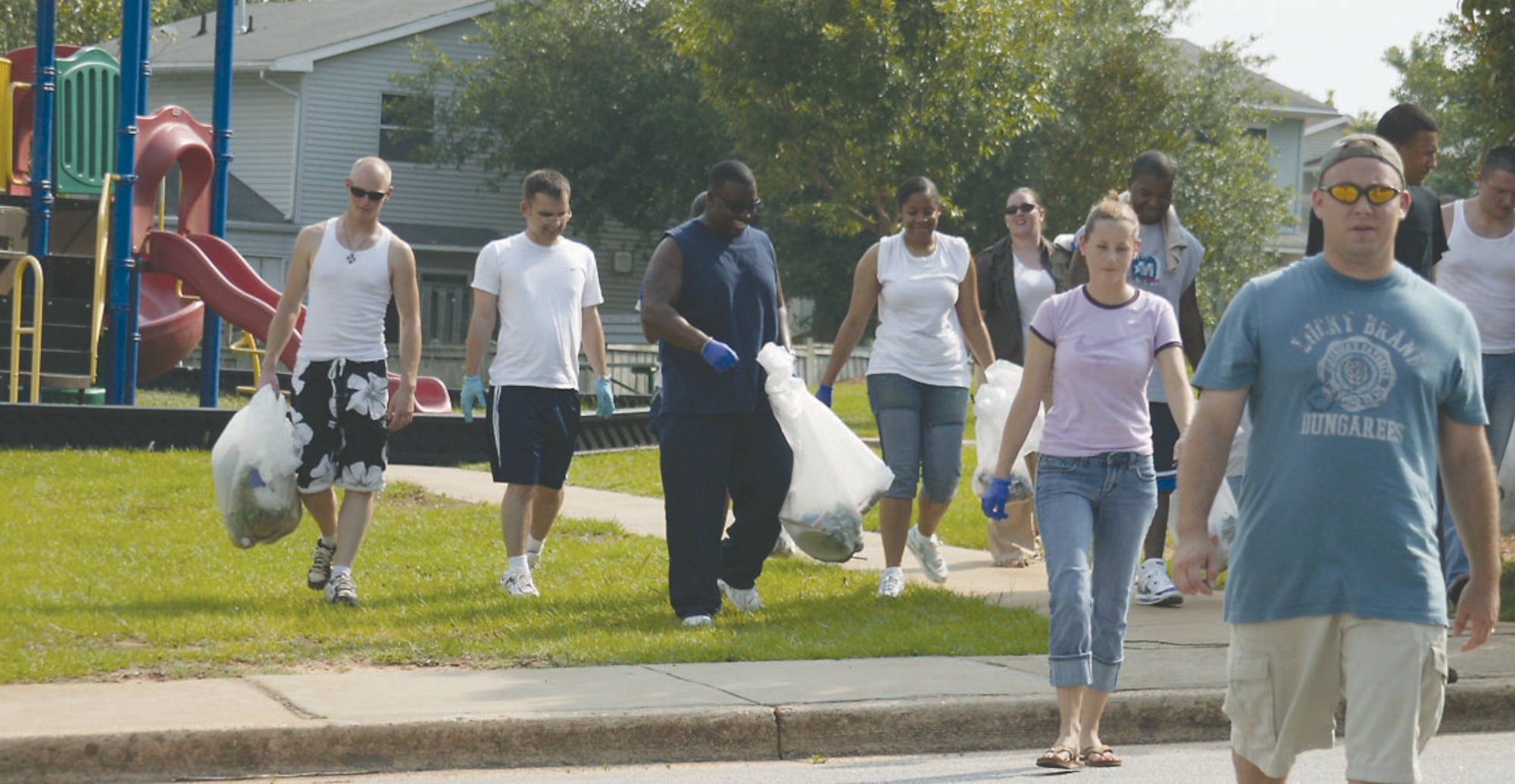 Students from Airman Leadership School class 06-5 finished cleaning up one of many Shaw playgrounds June 20.  They picked up 17 bags of trash including broken glass.  (U.S. Air Force Photo/Senior Airman John Gordinier)