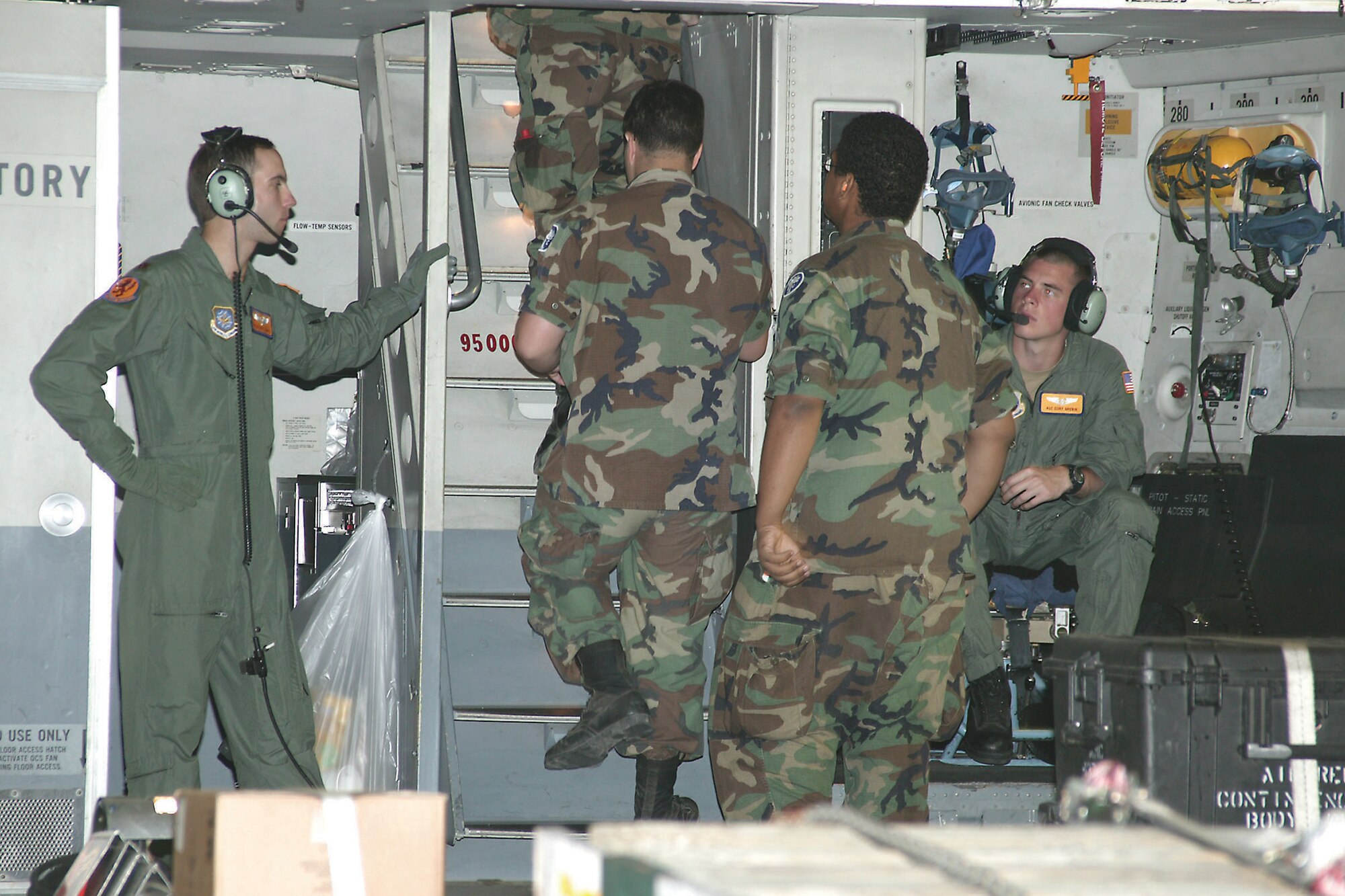 C-17 crew members from Charleston Air Force Base assist CAP members to the cockpit.   (U.S. Air Force Photo/Senior Airman John Gordinier)