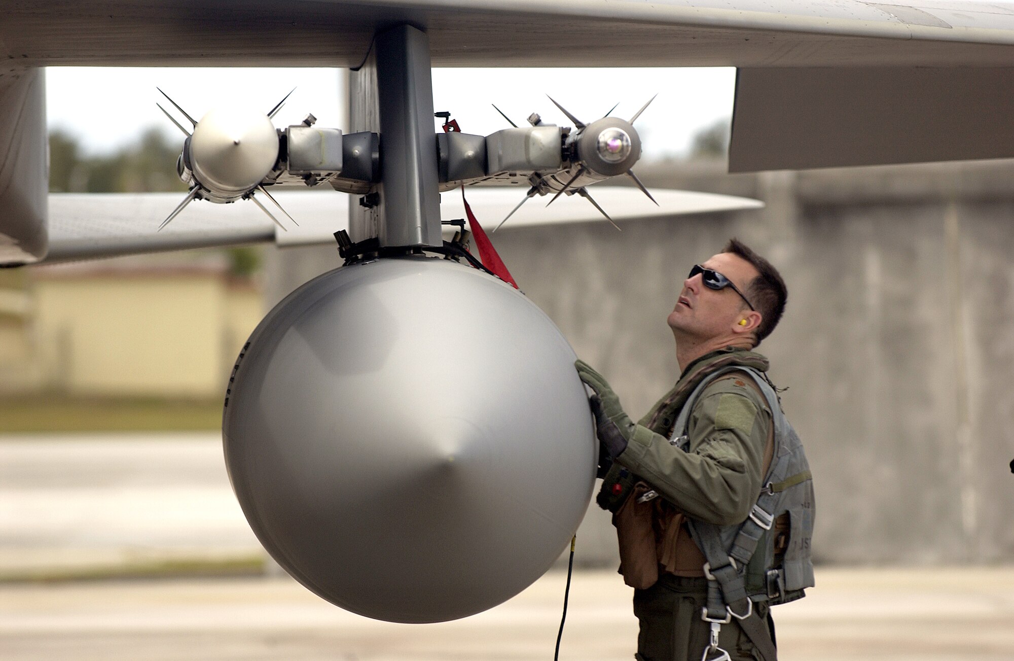 Maj. Paul Johnson pre-flights his F-15 Eagle before a training sortie during Exercise Valiant Shield at Andersen Air Force Base, Guam, on Thursday, June 22. The exercise focused on integrated joint training and interoperability among U.S. military forces while responding to a range of mission scenarios. Major Johnson is with the 44th Fighter Squadron at Kadena Air Base, Japan. (U.S. Air Force photo/Airman 1st Class Michael S. Dorus)