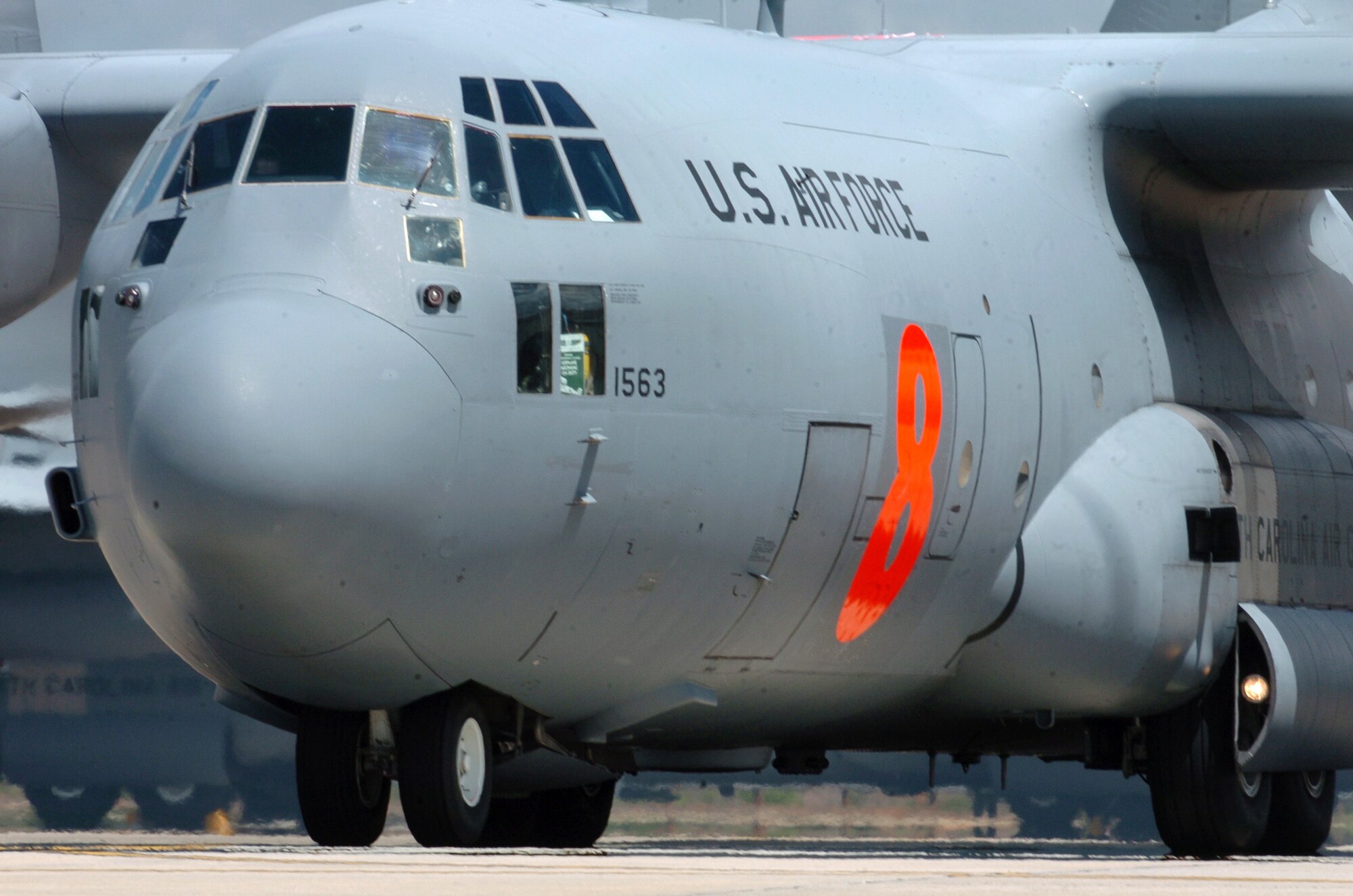 A C-130 Hercules readies for takeoff at the 145th Airlift Wing in Charlotte, N.C., on Sunday, June 25. The orange number "8" is the designation given by the USDA Forest Service to the modular airborne fire fighting system loaded on the aircraft. It can spray 3,000 gallons of fire retardant or water onto forest fires. Two C-130s from the 145th AW are deployed to Arizona to help combat forest fires. (U.S. Air National Guard photo/Tech. Sgt. Brian E. Christiansen)