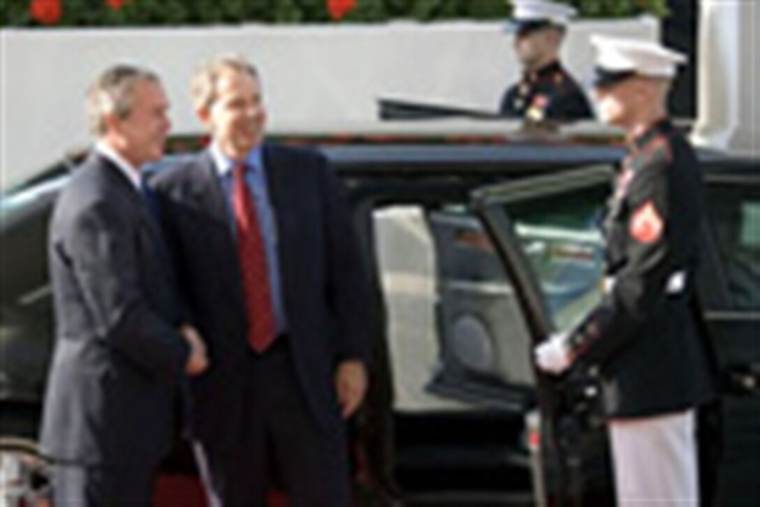 President George W. Bush welcomes British Prime Minister Tony Blair to the White House prior to their joint news conference May 25, 2006 in the East Room of the White House. 