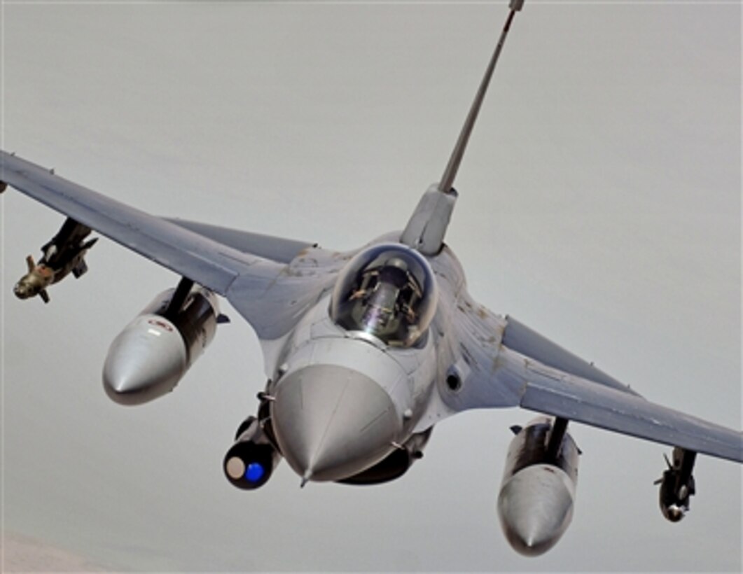 An F-16 Fighting Falcon aircraft flies during a mission over central Iraq, May 14, 2006. The fighter is assigned to the 332nd Air Expeditionary Wing at Balad Air Base, Iraq. 