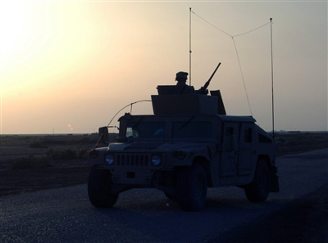 U.S. soldiers from Company F, 1st Battalion, 68th Armor Regiment, 4th Infantry Division, drive a Humvee through route green in Narwan, Iraq on April 10, 2006. 