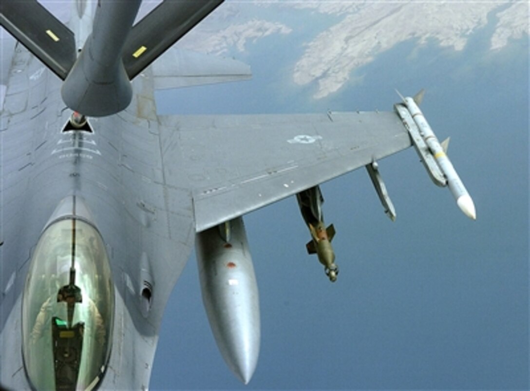 An F-16 Fighting Falcon aircraft connects with the refueling boom of a KC-135 Stratotanker aircraft over Iraq, May 7, 2006. 