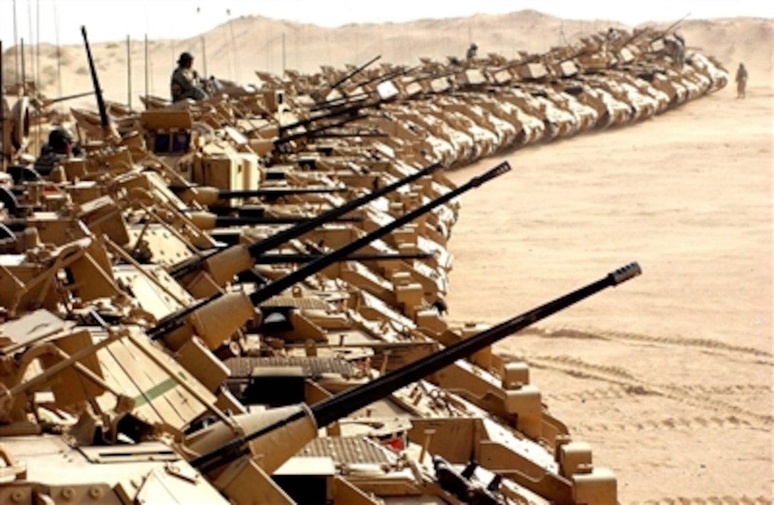 U.S. Army Bradley fighting vehicles of the 1st Battalion, 4th Infantry, line up at the Udairi Desert Range, April 10, 2006, before moving forward into Iraq. 