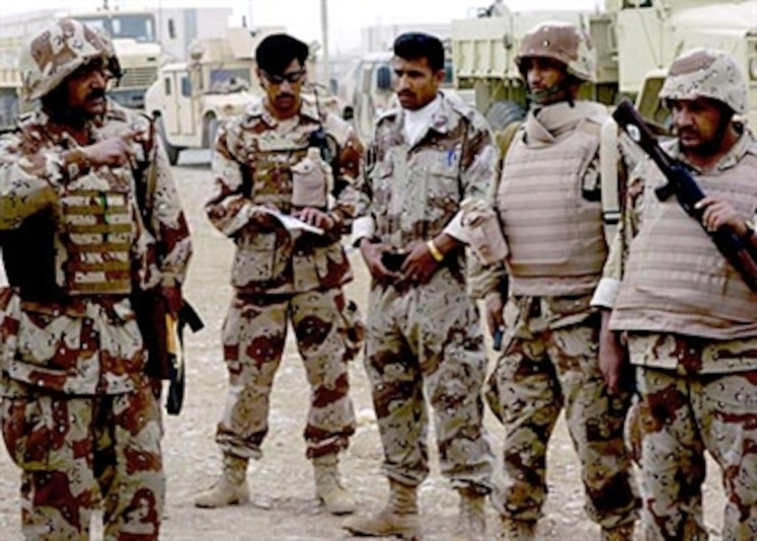 An Iraqi Army captain conducts a mission brief prior to departing their base for convoy training at Kirkuk, Iraq, April 26, 2006. U.S. soldiers have been training Iraqi Army troops on convoy operations which marks another step in the growing independence of the Iraqi Army. 