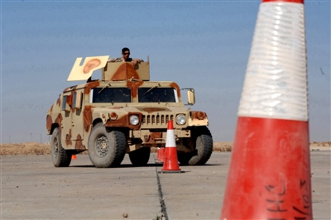 An Iraqi army soldier with 2nd Brigade, 4th Iraqi Army Division practices driving a Humvee during a driver-training course at Forward Operating Base Speicher, Iraq, Feb. 23, 2006. U.S. Army soldiers with Forward Support Company, 1st Battalion, 187th Infantry Regiment, 101st Airborne Division are conducting the training exercise.