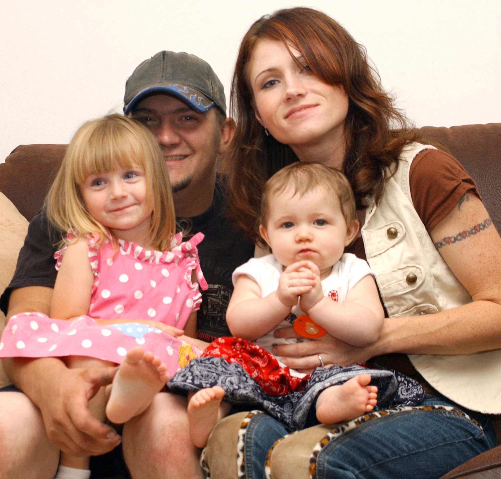 Life is getting back to normal for Senior Airman Aaron and Stephenie Post, here with 3-year-old Austin and 10-month-old Sage Madison, after having settled in a home in military family housing. (U.S. Air Force photo/Kemberly Groue)