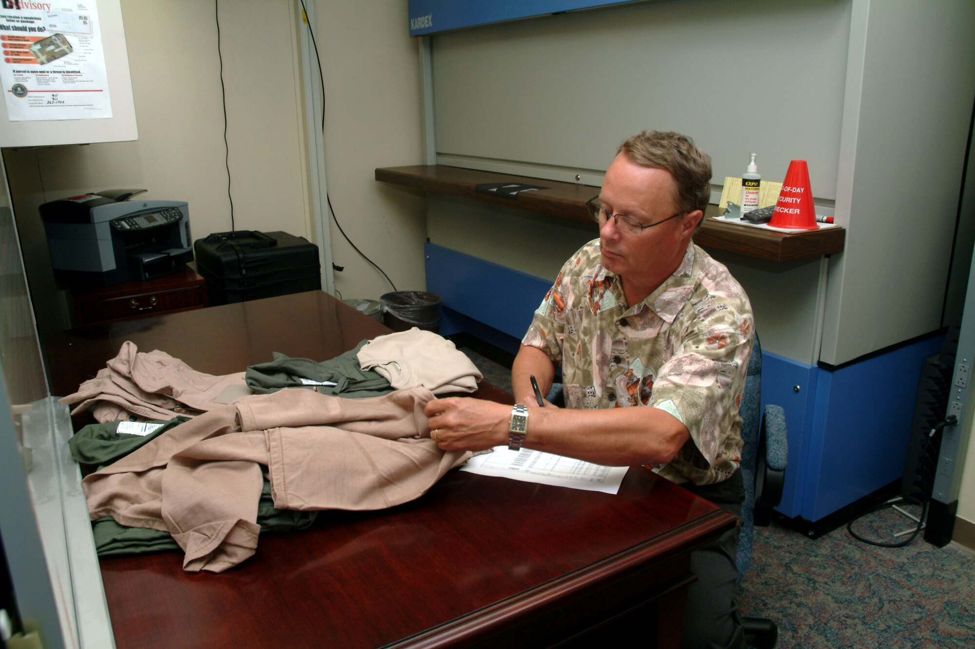 Danny Keith assigns a batch of the new flight suits and T-shirt prototypes to one of the volunteers participating in the operational utility evaluation. The uniform prototypes are being tested through Nov 1. Mr. Keith is assigned to the 28th Test and Evaluation Squadron aircrew life support division at Eglin Air Force Base, Fla. (U.S. Air Force photo)
