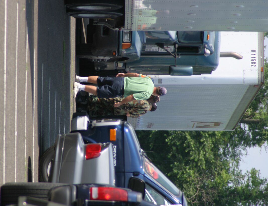 111th Fighter Wing, PA Air National Guard, guardsmen process FEMA Trucks before sending into the truck parking/detention area. 