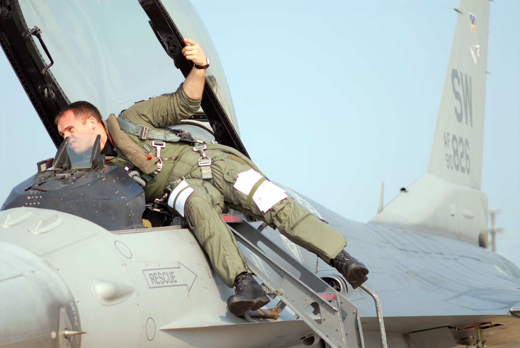 Capt. Ben Russo does a pre-flight check on his F-16 Fighting Falcon before a mission supporting Operation Dynamic Weasel on Thursday, June 29, at Shaw Air Force Base, S.C. The exercise features various aircraft imitating combat operations in Southwest Asia. Captain Russo is assigned to the 77th Fighter Squadron. (U.S. Air Force photo/Tech. Sgt. James Arrowood) 
