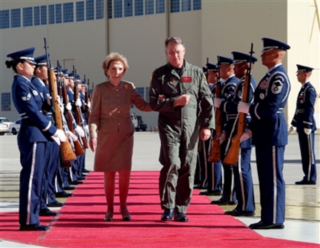 U.S. Air Force Lt. Gen. John Bradley escorts former first lady Nancy Reagan during a ceremony to dedicate a C-17 Globemaster III -- the Spirit of Ronald Reagan -- to honor her late husband, President Ronald Reagan at March Air Reserve Base, Calif., Jan. 13, 2006. The general is chief of the Air Force Reserve and commander of Air Force Reserve Command.