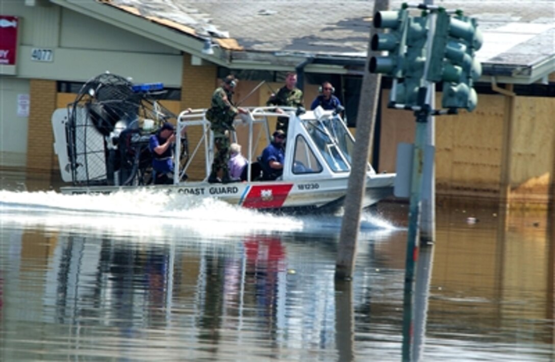 A U.S. Coast Guard air boat returns to a local staging area in New Orleans, La., with survivors of Hurricane Katrina, Sept. 8, 2005. The evacuees will be taken to a shelter after undergoing a medical exam. 