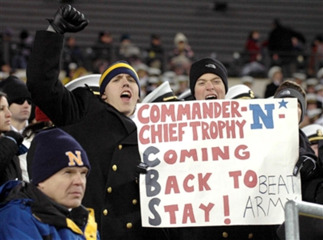 Midshipmen of the U.S. Naval Academy cheer in anticipation of their football team winning the Commander-in-Chief trophy for the fourth year in a row during the 106th Army-Navy football game held Dec. 3 in Philadelphia. Navy defeated Army 42-23. 