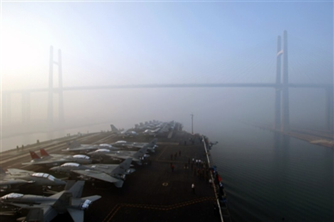 The USS Theodore Roosevelt passes under the Friendship Bridge during transit through the Suez Canal, Sept. 27, 2005. The nuclear powered aircraft carrier is underway on a regularly scheduled deployment in support of the Global War on Terrorism.