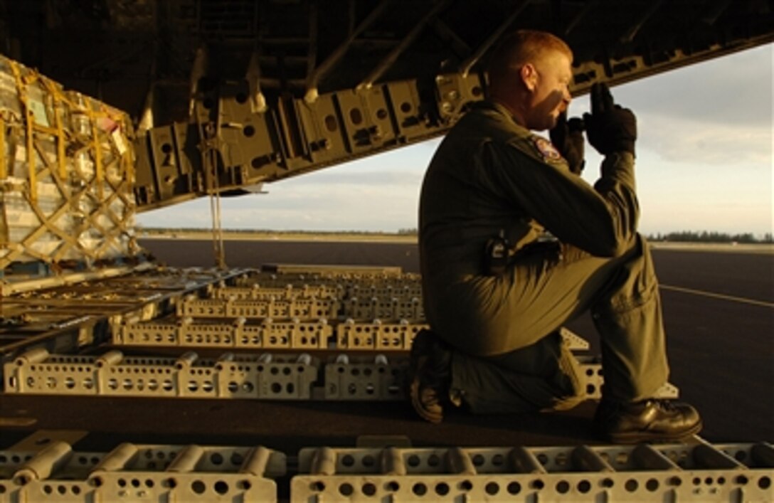 U.S. Air Force Master Sgt. S.M. Lynch, a loadmaster assigned to the 68th Airlift Squadron, Kelly Field, Texas, directs a forklift into position to unload relief supplies from a C-17 Globemaster at Homestead Air Reserve Base, Fla., Oct. 27, 2005, in support of Hurricane Wilma relief efforts.