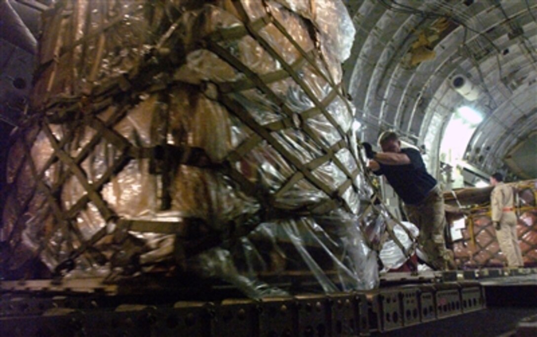 U.S. Air Force airmen from the 818th Contingency Response Group, McGuire Air Force Base, N.J., off load equipment from a C-17 Globemaster III from Charleston Air Force Base, S.C., at Chaklala Air Base, Pakistan, in support of earthquake relief efforts Oct. 17, 2005.