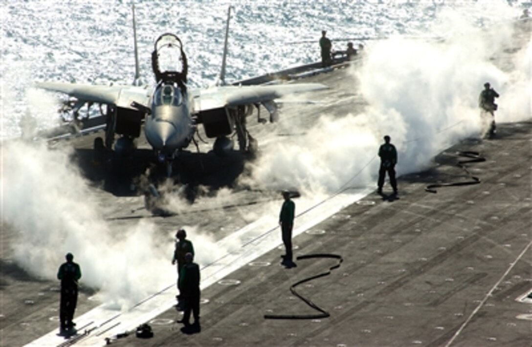 Air Department personnel run no-load tests on a catapult aboard the Nimitz-class aircraft carrier USS Theodore Roosevelt in the Persian Gulf, Nov. 27, 2005. The Roosevelt and embarked Carrier Air Wing 8 are conducting maritime security operations.