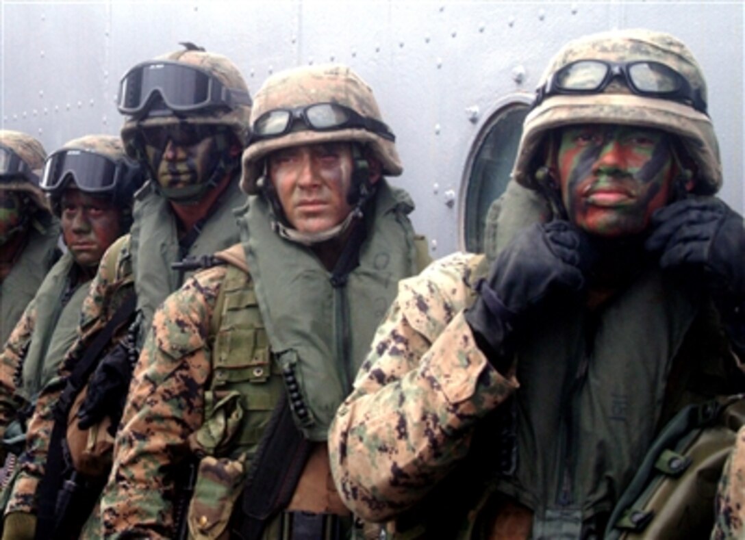 Marines from 31st Marine Expeditionary Unit's Fox Company wait to board a CH-46E Sea Knight on the USS Juneau Oct. 29, 2005, during Amphibious Landing Exercise 06 in the Philippines.  
 