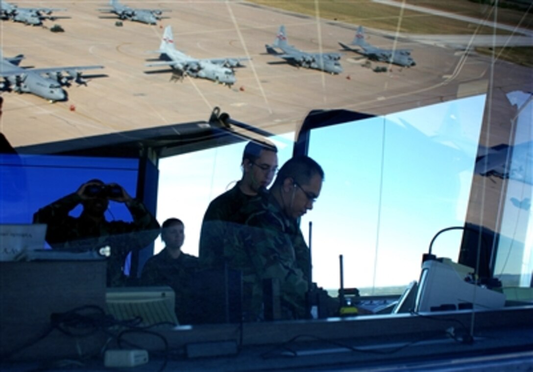 U.S. Air Force personnel conduct air traffic operations in the control tower on Dyess Air Force Base, Texas. The airmen are assigned to the 7th Operational Support Squadron, and keeping a watchful eye over the flight line is part of their day-to-day duties.  
