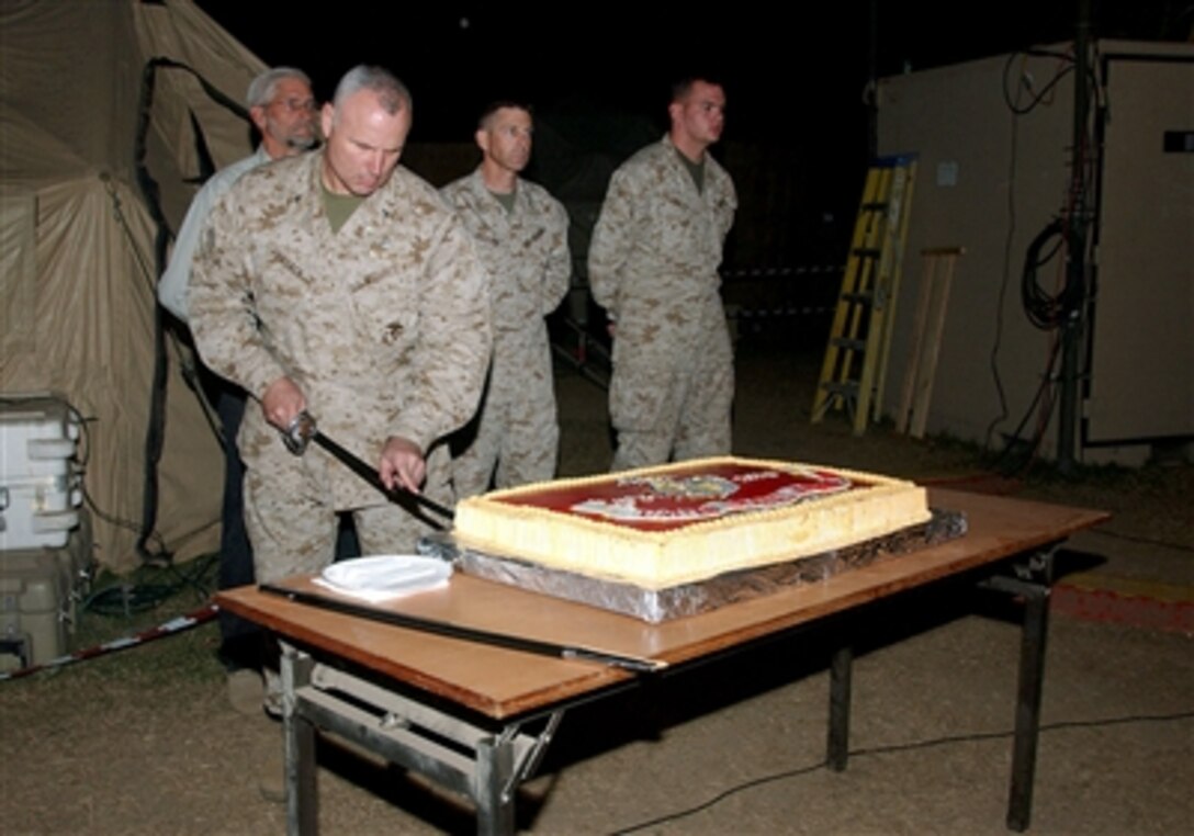 U.S. Marine Corps Colonel Michael Losack, Disaster Assistance Center Chief of Staff, cuts the first piece of U.S. Marine Corps birthday cake at Chaklala Air Base, Pakistan, Nov. 10, 2005. Today marks the 230th birthday of the U.S. Marine Corps. This tradition includes passing the cake from the oldest Marine to the youngest, symbolizing wisdom being passed on to the younger generation. 
 