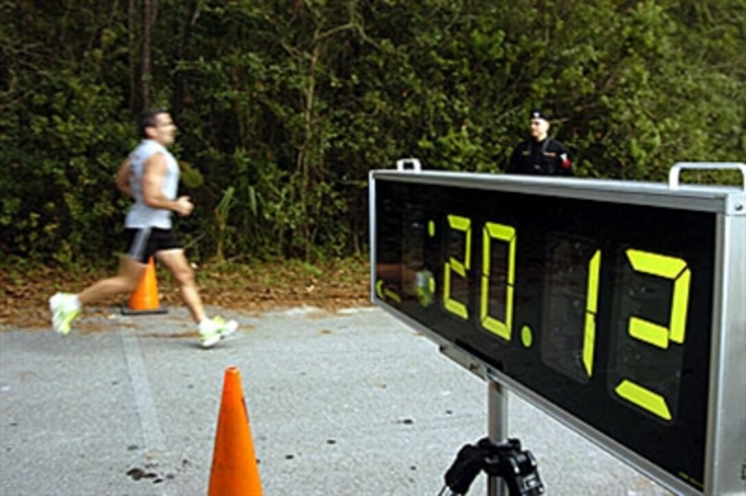 U.S. Navy Petty Officer 1st Class Jacen Mapes, assigned to Naval Air Reserve Jacksonville crosses the finish line during the Martin Luther King Jr. 5K Fun Run at Naval Air Station Jacksonville, Fla., Jan. 11, 2006. The event was sponsored by Morale, Welfare and Recreation.