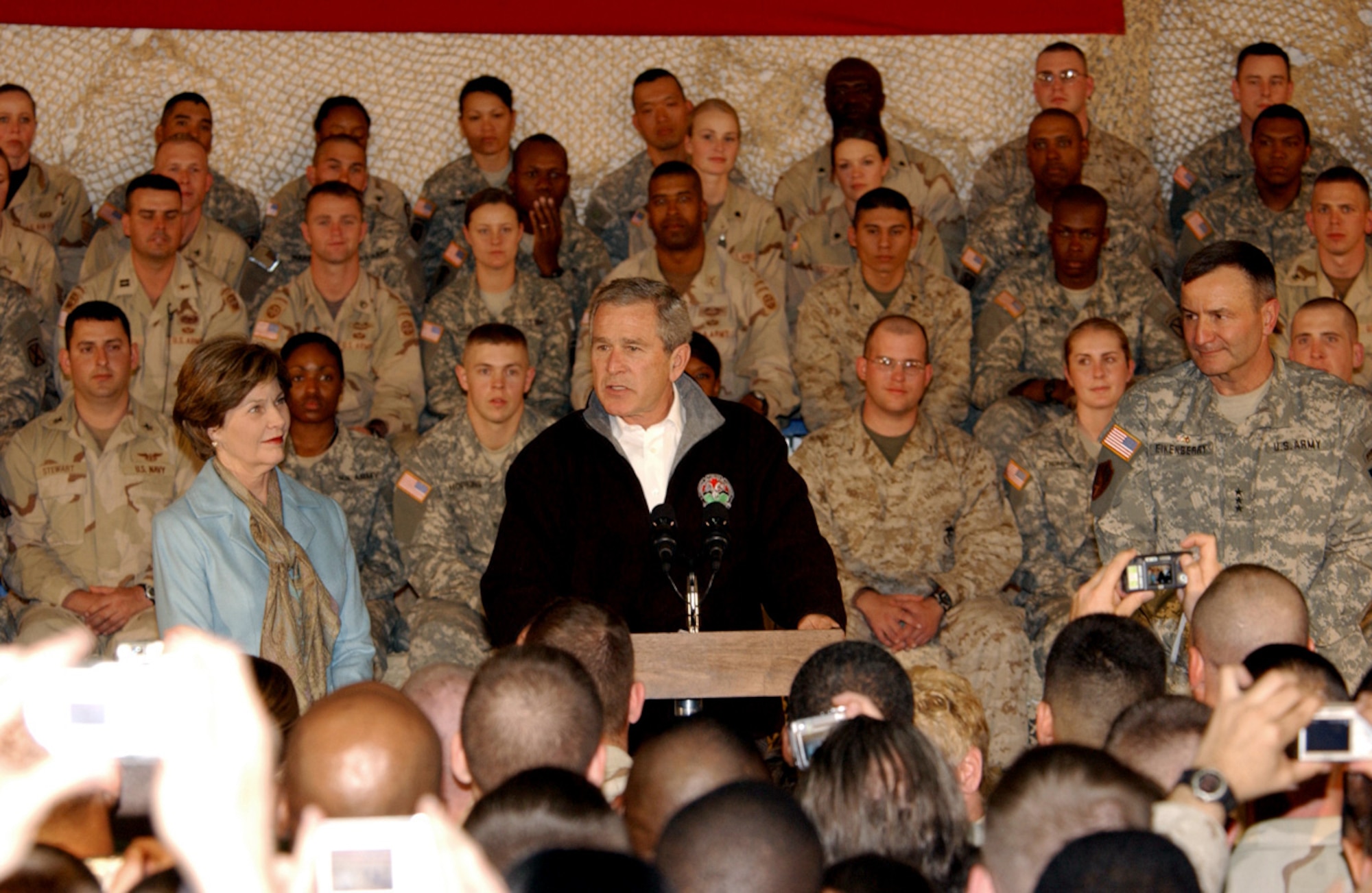 President George W. Bush, the First Lady, Laura Bush, and Lt. Gen. Karl Eikenberry, Combined Forces Command - Afghanistan commander, pay a surprise visit to troops here March 1. (U.S. Army photo/Pfc. Brian Schroeder)