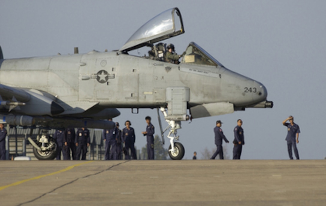 U.S. Air Force Maj. Chris Price taxis out his A-10 Thunderbolt II aircraft for an Exercise Cope Tiger '06 mission from the Korat Royal Air Force Base, Thailand, on Feb. 8, 2006. Cope Tiger provides air-to-air, air-to-ground and large force employment training for crews in a multi- national environment. The annual exercise involves over 300 U.S. military members and 1,000 military members from Thailand and Singapore. Price is assigned to the 25th Fighter Squadron from Osan Air Base, South Korea. 