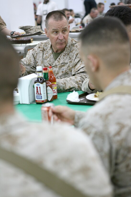 Lieutenant General John F. Sattler; commanding general of Marine Forces Central Command, enjoys lunch while visiting with junior Marines, sailors and soldiers at the chow hall at Camp Taqaddum, Iraq, on March 1, 2006.  His visit here was the final leg in a tour of bases across the Al Anbar Province that included Camp Fallujah and Al Asad Air Base. Sattler, who is also the commanding general of the I Marine Expeditionary Force at Camp Pendleton, Calif., encouraged the servicemembers to call or email home as often as possible, saying the communication â??helps make you fight better.â?