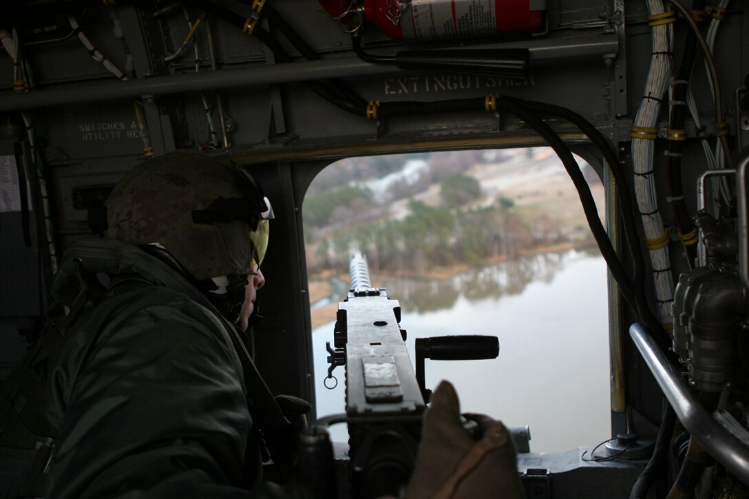 ABOARD THE USS PELELIU (March 1, 2006) - (Center) Sgt. Coy P. Loftin, High Risk Personnel Protection platoon member, command element, 11th Marine Expeditionary Unit, Camp Pendleton, Calif., from Biloxi, Miss., stands by for the next shooting drill during a HRPP live-fire exercise aboard the USS Peleliu Mar. 2.  The HRPP platoon is comprised of specially selected personnel from the 11th MEU's command element. Their mission is to provide personal security to 11th MEU and other high-ranking government officials. The 11th MEU (SOC) is currently on a six-month deployment to the Western Pacific and Arabian Gulf aboard the Peleliu in support of the Global War on Terrorism.