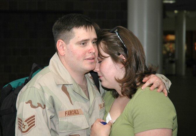 Staff Sgt. Jeff Fairchild, an Air Force reservist assigned to the 81st Aerial Port Squadron, Charleston AFB, S.C., embraces his wife at the Charleston International Airport, as he waits to leave for an extended deployment.  (Photo by 1st Lt. Wayne Capps, USAFR)