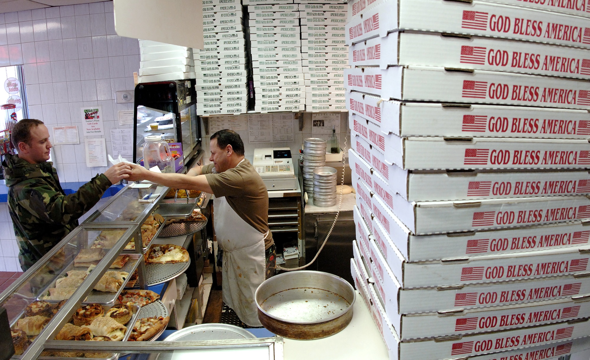 Manager Mike Refat serves a customer in his restaurant.  He appreciates the 106th Rescue Wing being near his establishment.  Mr. Refat has been the manager at Tonino's for 12 years and knows most of the guardsman at Francis E. Gabreski Field by name. (U.S. Air Force photo/Master Sgt Jack Braden)