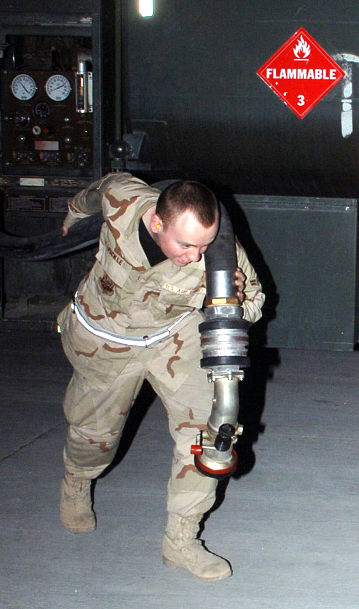 Airman 1st Class Jay Pickle pulls out a fuel hose to fill an A-10 Thunderbolt II aircraft. Airman Pickle is a mobile distribution operator with the 455th Expeditionary Logistics Readiness Squadron petroleum oil and lubricant element. The fuels Airmen deliver more than 415,000 gallons of fuel every week. (U.S. Air Force photo/Staff Sgt. Jennifer Redente)
