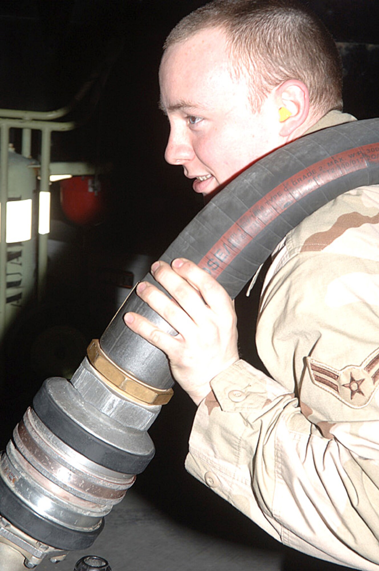 Airman 1st Class Jay Pickle pulls a fuel hose to fill an A-10 Thunderbolt II aircraft. Airman Pickle is a mobile distribution operator with the 455th Expeditionary Logistics Readiness Squadron petroleum oil and lubricant element. The fuels Airmen deliver fuel to more than 35 aircraft per day and more than 415,000 gallons per week. (U.S. Air Force photo/Staff Sgt. Jennifer Redente)
