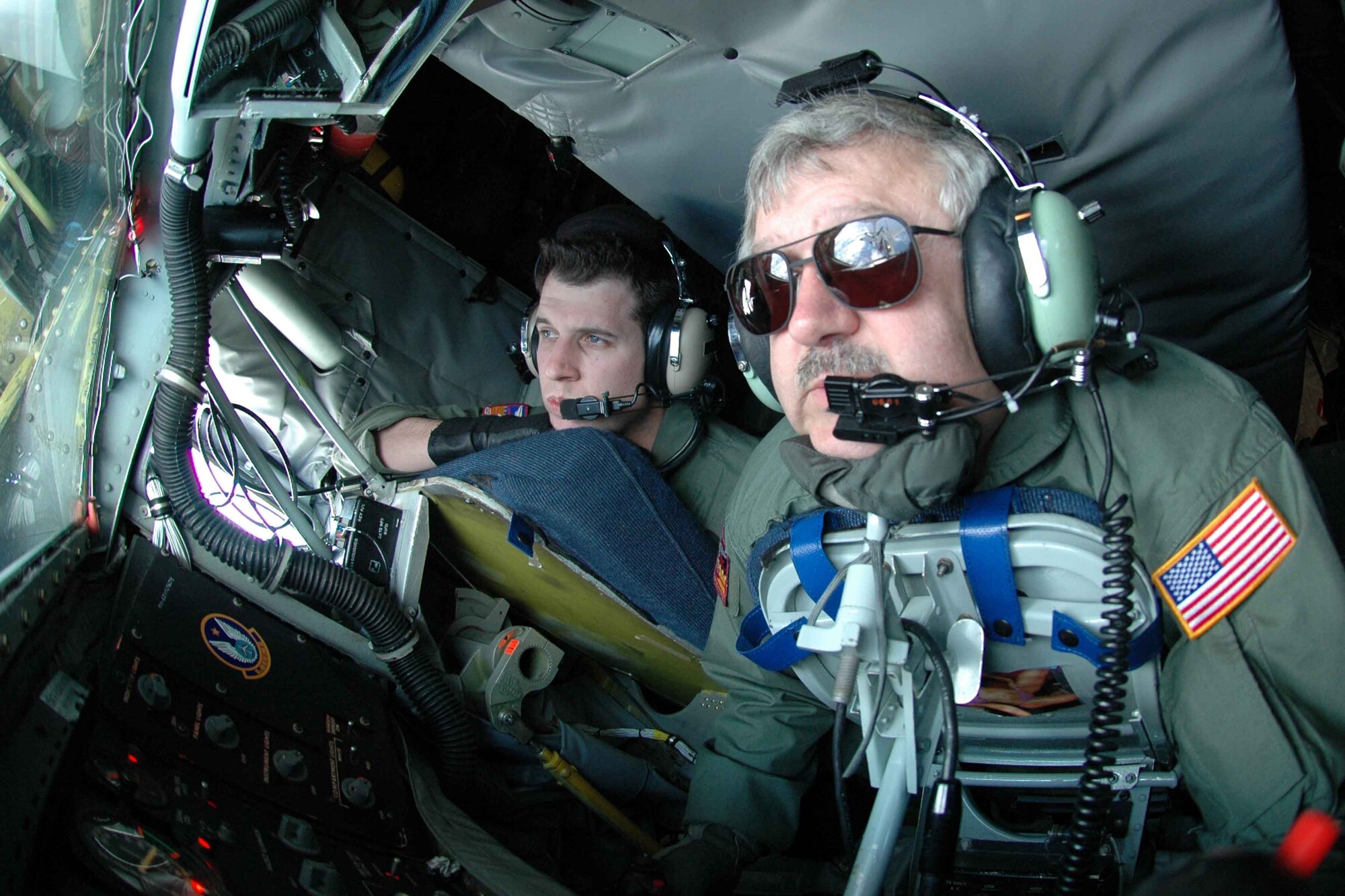OVER THE GULF OF MEXICO - Senior Master Sgt. Ken Albers refuels an F-15 Eagle from the 46th Test Wing during a Tomahawk cruise missile test while Senior Airman Josh Krenegel looks on. Using both of Eglin's water and land test ranges, a U.S. Navy Tomahawk cruise missile was launched from the USS Boise, a Los Angeles-class submarine that was under way in the Gulf of Mexico. The Airmen supporting the test in the KC-135 Stratotanker are boom operators from the 384th Air Refueling Squadron at McConnell Air Force Base, Kan. (Air Force photo by Senior Airman Mike Meares)

