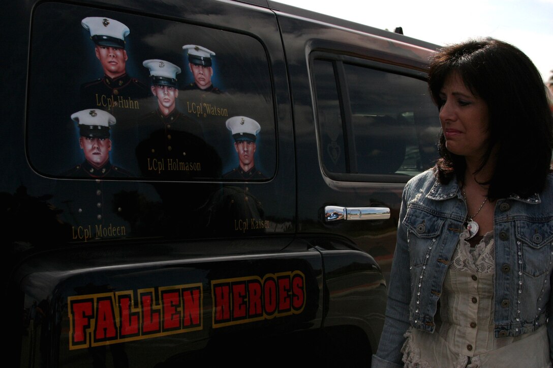 Karla Comfort had her son, 20-year-old Lance Cpl. John M. Holmason, and nine other Marines with F Company, 2nd Battalion, 7th Marine Regiment, 1st Marine Division, painted on a 2006 Hummer H3. The Marines were all killed by the same improvised explosive devise blast in Fallujah, Iraq, in December. Comfort visited Camp Pendleton and displayed the rolling memorial March 2. The custom paintjob, which was done by artist Robert Powell with AirbrushGuy & Co. in Benton, Ark., and took 250 man-hours to complete, was a way for Comfort to pay tribute to her son and keep his memory alive.