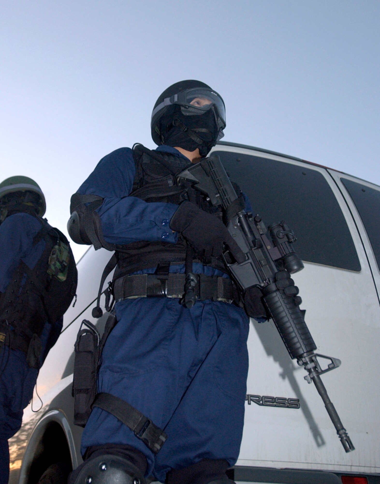 A member of 36th Security Forces Squadron's High Intensity Tactical Team stands guard outside an elementary school during a hostage negotiation exercise, Wednesday, Feb. 22, 2006, at Anderson Air Force Base, Guam. (U.S. Air Force photo/Airman Michael S. Dorus)