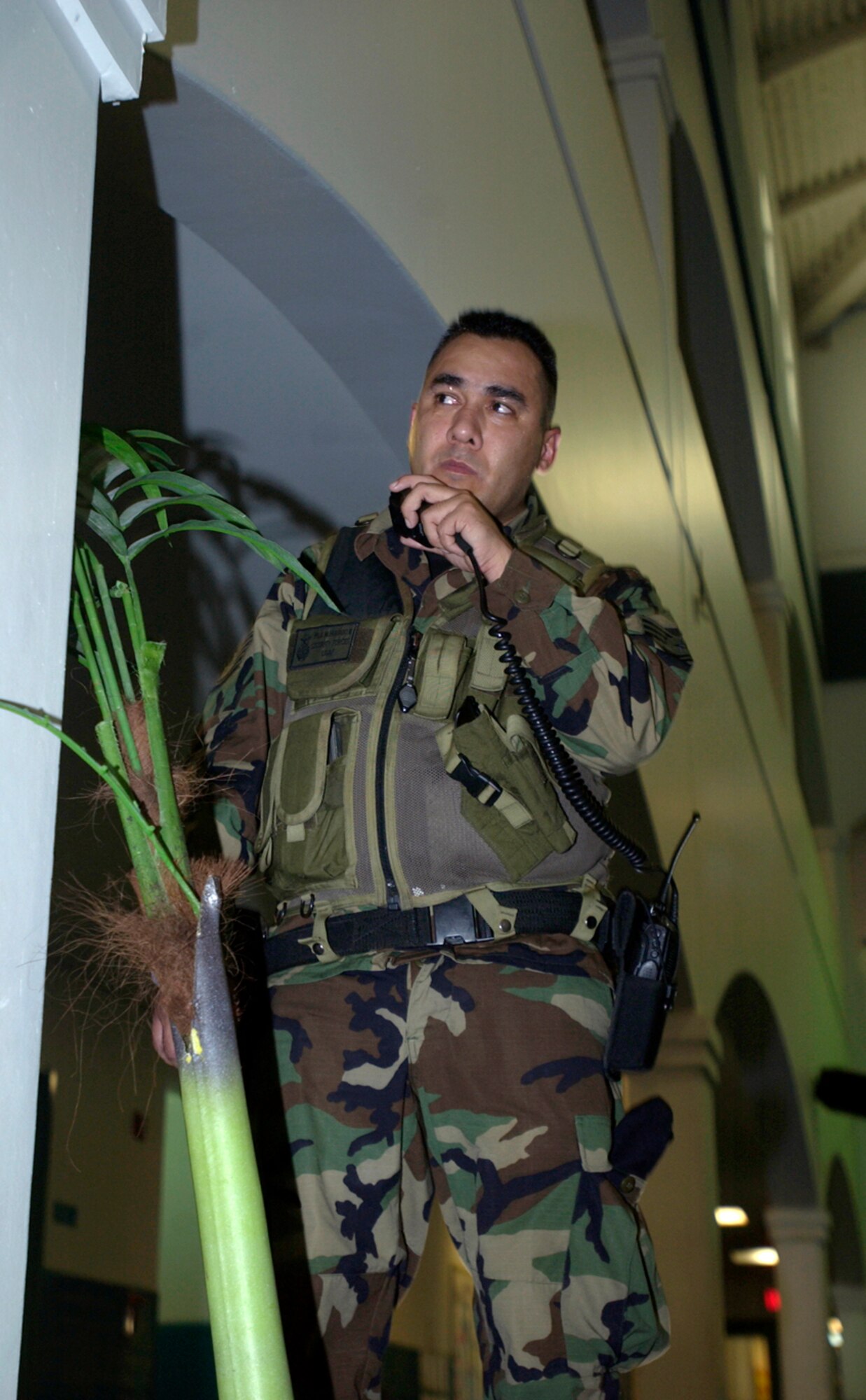 During a hostage negotiation exercise, Tech. Sgt Felix Hurtado watches the door of an elementary school classroom where an upset parent has taken four students and a teacher captive, Wednesday, Feb. 22, 2006, at Anderson Air Force Base, Guam.  Sergeant Hurtado is with the 36th Security Forces Squadron. (U.S. Air Force photo/Airman Michael S. Dorus)