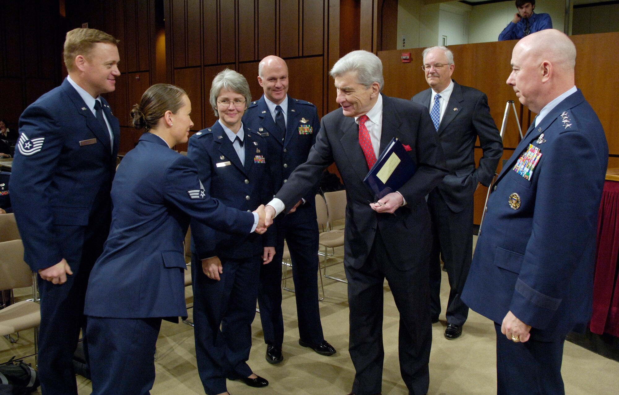 Sen. John Warner (R-Va.) greets Airmen attending the Senate Armed Services Committee hearing Thursday, March 2, 2006, in Washington, D.C. At right are Air Force Chief of Staff Gen. T. Michael Moseley and Secretary of the Air Force Michael W. Wynne. The invitees are, from left: Senior Airman Polly-Jan Bobseine, a security forces specialist with the 823rd Security Forces Squadron, Moody Air Force Base, Ga.; Tech. Sgt. Bradley Reilly, a combat controller with the 23rd Special Tactics Squadron, Hurlburt Field, Fla.; Lt. Col. Anne Konnath, commander of the 328th Weapons Squadron, Nellis Air Force Base, Nev.; and Lt. Col. Trey Turner III, commander of the 17th Reconnaissance Squadron, Nellis AFB, Nev. (U.S. Air Force photo/Master Sgt. Jim Varhegyi)