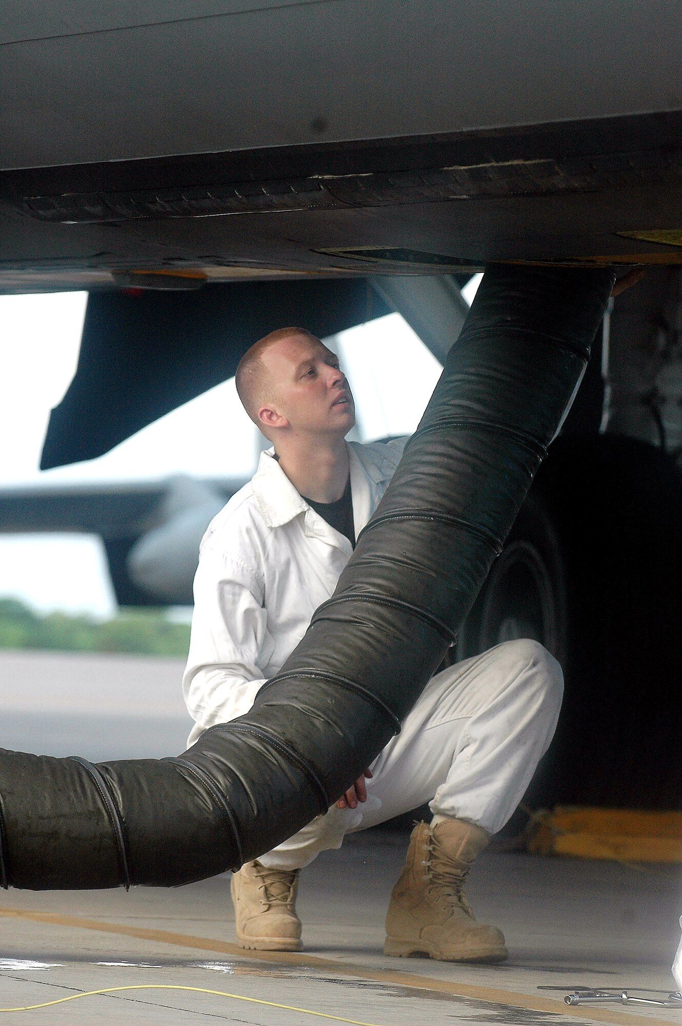 Senior Airman Keith Dodge uses forced air to purge fumes from a fuel bladder being replaced on a KC-135 Stratotanker operating in support of Operation Enduring Freedom. Airman Dodge is a fuel systems apprentice with the 28th Expeditionary Air Refueling Squadron. (U.S. Air Force photo/Staff Sgt. Doug Nicodemus)

